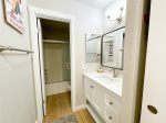 Primary bathroom with separate sink and shower areas